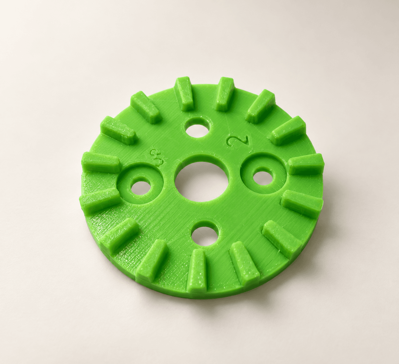 Bright green 3D printed circular mechanical rotor plate