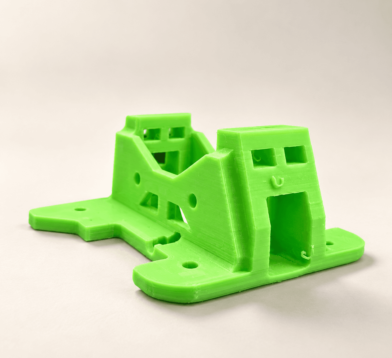 Bright green 3D printed equipment mounting bracket